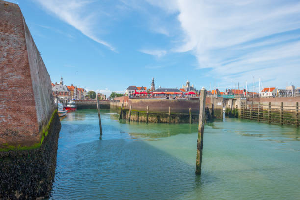 istock Harbor of a city below a blue cloudy sky in summer 838564014