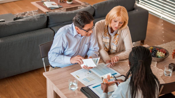 istock Insurance agent discussing with couple 838566774