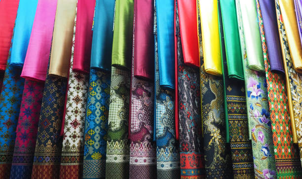 row of colorful set Kebaya skirt dress in local market display stock photo