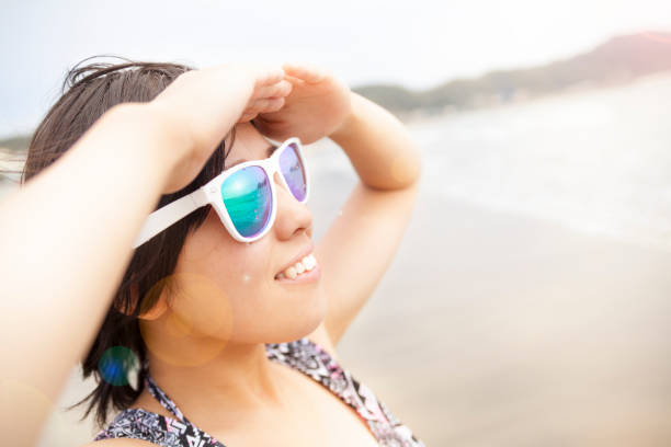 istock Young Woman Looking Away At Beach 838573092