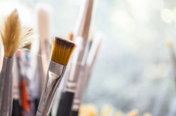 istock Paint brushes in front of the window 838578788