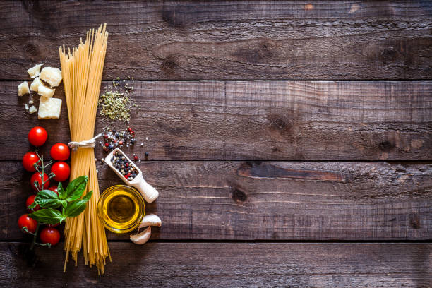 istock Spagetti with ingredients on rustic wooden table 838579022