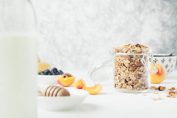 istock Granola in a jar with fruits and milk. 838580216