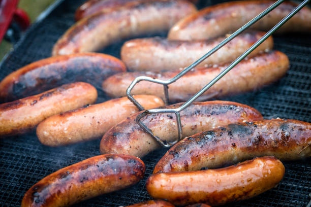 istock Crispy wieners on an outdoor grill 838580826