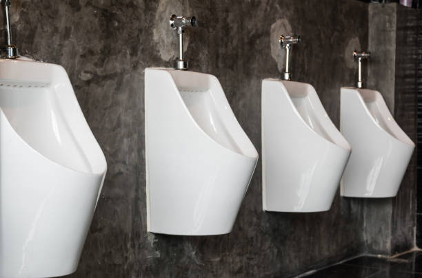 row of urinal in male restroom - toilet public restroom bathroom flushing imagens e fotografias de stock