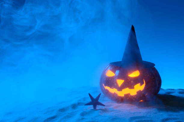 istock Creepy pumpkin on sandy beach 838740696
