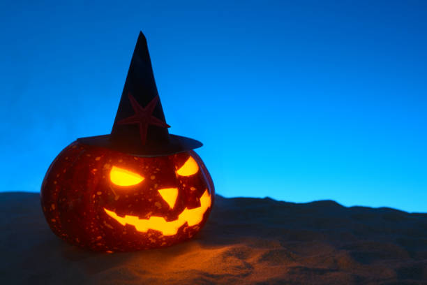istock Creepy pumpkin on sandy beach 838740758