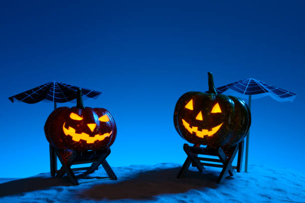 istock Carved pumpkins in composition on sand 838740858