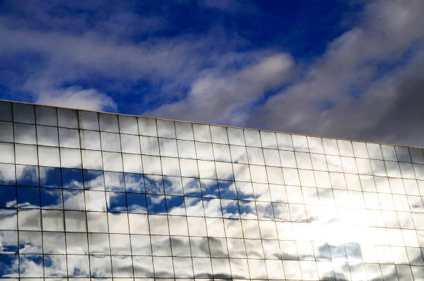 istock Rennes south station mirror window reflections of clouds 838757376