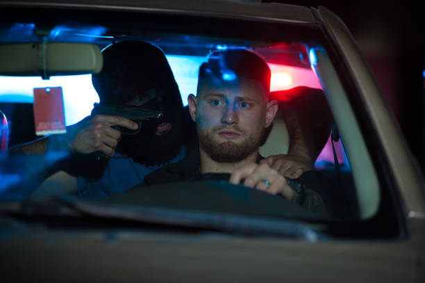 istock Car thief threatening auto owner with the gun. 838769610