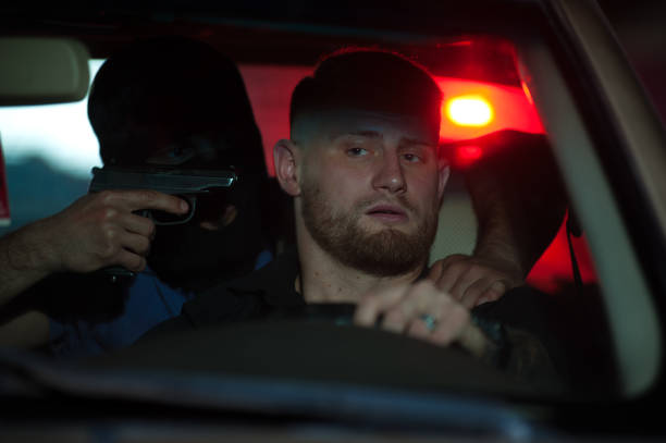 istock Car thief threatening driver with the gun. 838769850