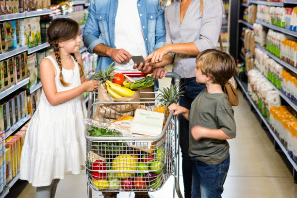 istock Cute family doing grocery shopping together 838771296