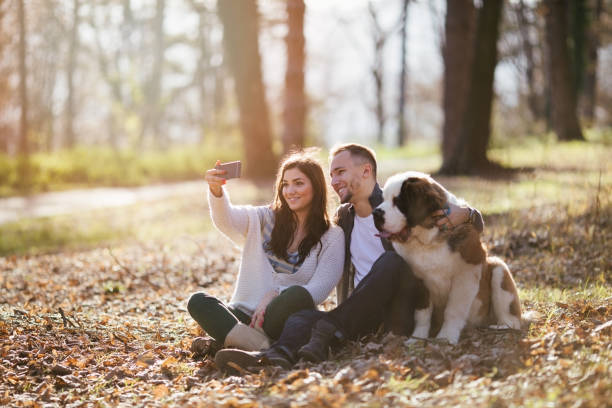 istock Couple and dog in park 838772832