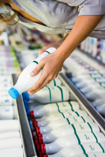 istock Woman reading the ingredient on a milk bottle 838772844