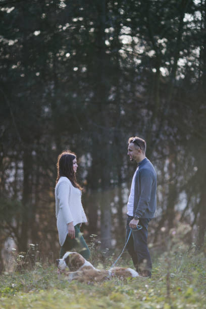istock Couple and dog in park 838775404