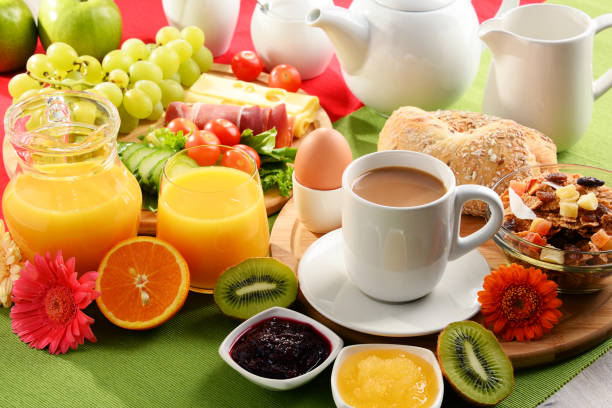 istock Breakfast served with coffee, orange juice, egg and fruits 838779644