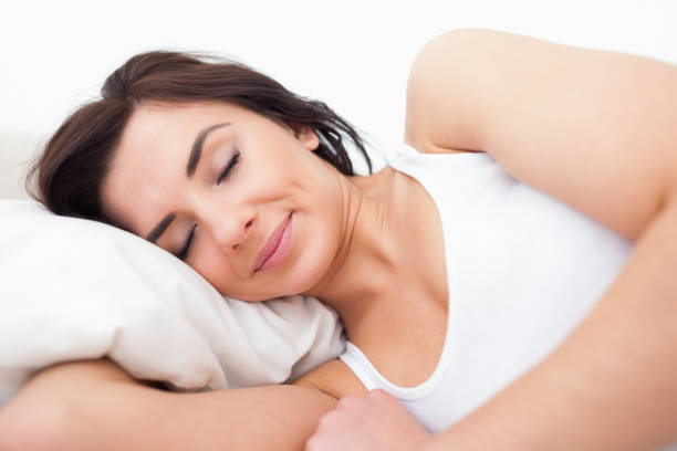 istock Peaceful woman lying while sleeping in the morning 838788728