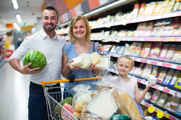 istock Young parents with child shopping in hypermarket 838795444