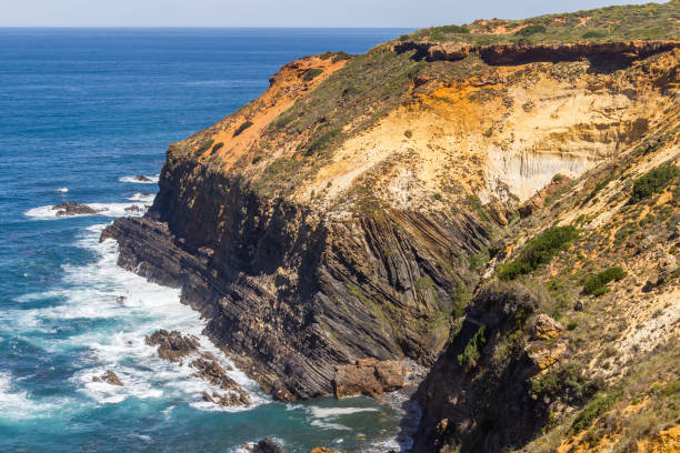istock Wave and cliffs in the Beach in Almograve 838816456