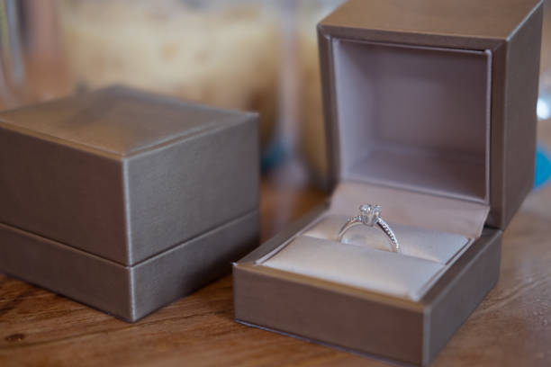 istock close up of gift box with diamond engagement ring 838826828
