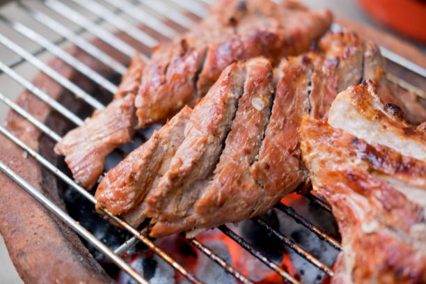 istock Pork steaks on the grill with flames 838827062