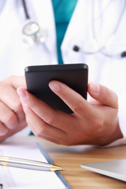 istock Female doctor using mobile phone 838829662