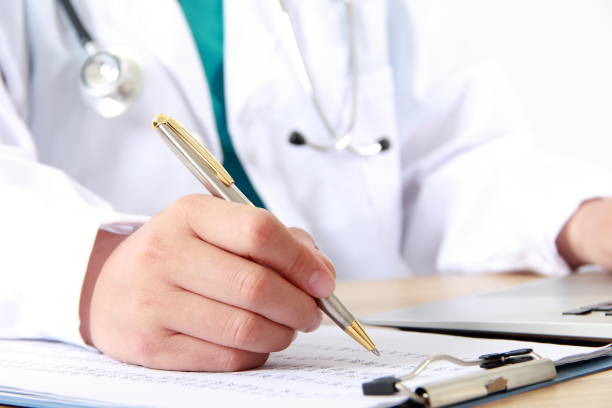 istock Female doctor writing on a clipboard 838829778