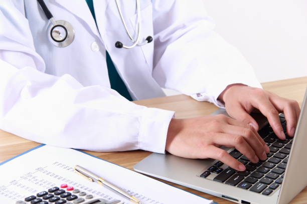 istock Female doctor typing with laptop 838829878