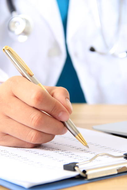istock Female doctor writing on a clipboard 838830072