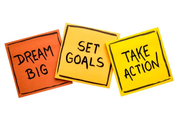 dream big, set goals, take action concept - motivational advice or reminder on colorful sticky notes isolated on white