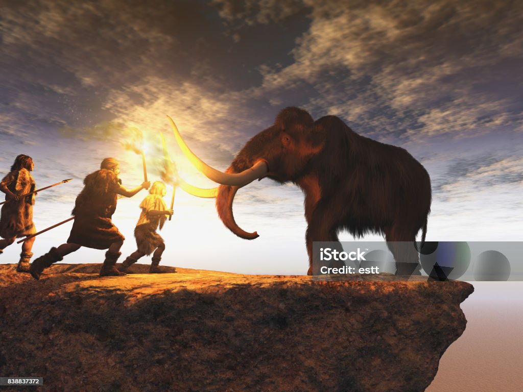 Prehistoric men hunting a young mammoth Neanderthal Stock Photo