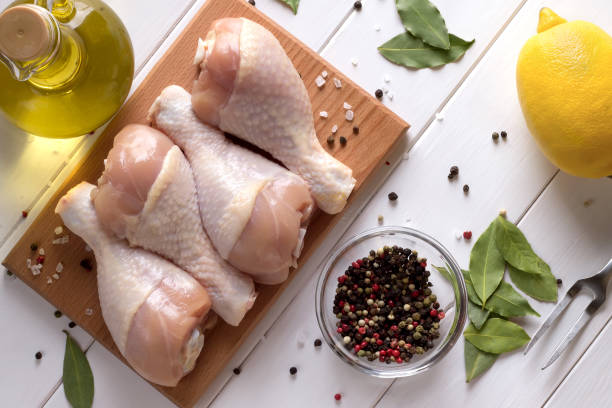 istock Fresh raw chicken meat on cutting board with spices. Top view. 838843064