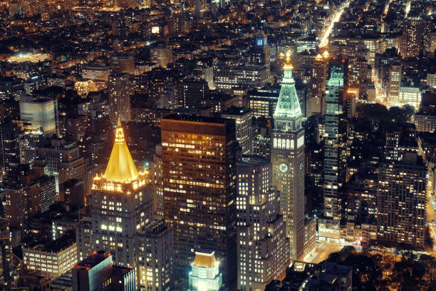 New York City historical skyscrapers New York City historical skyscrapers and urban cityscape at night. new york life building stock pictures, royalty-free photos & images