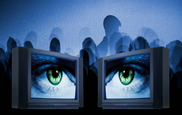 Old fashioned television with eyes against matrix screen