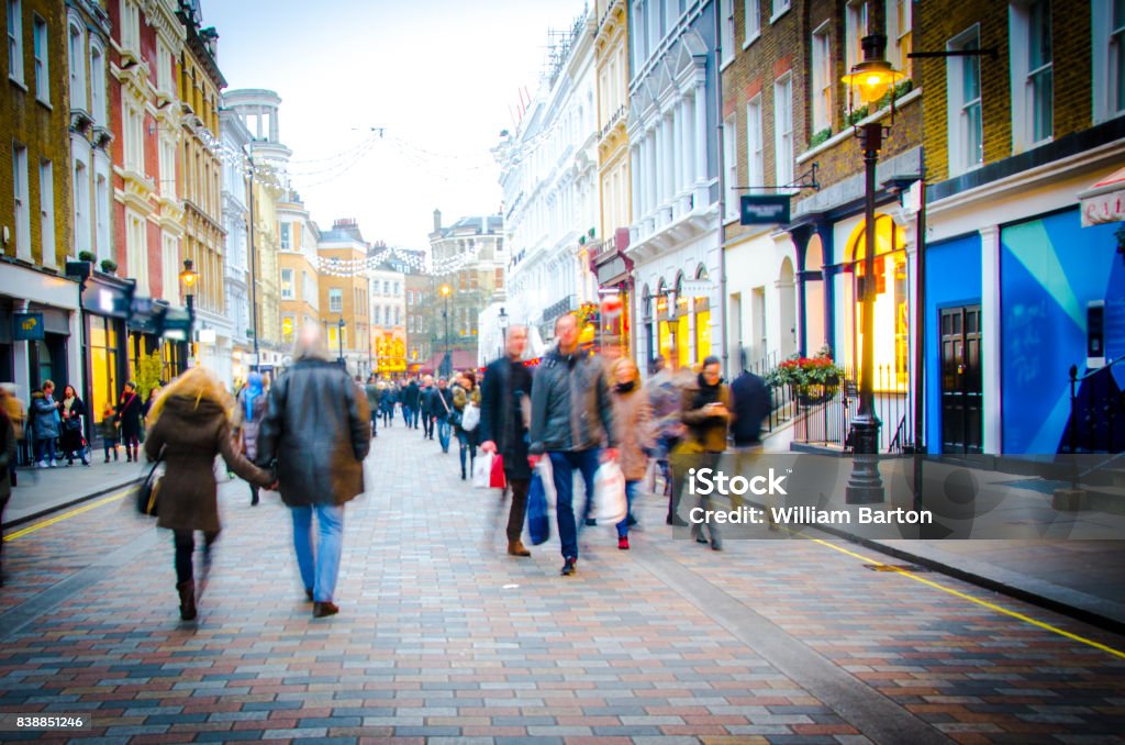 High Street shoppers Many people on English shopping high street City Street Stock Photo