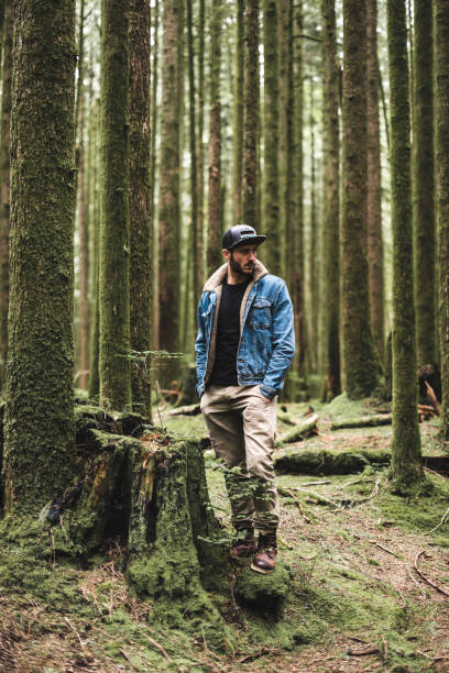 istock solitude traveler walking into the wood 838857224