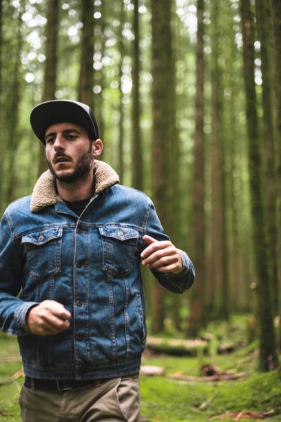 istock solitude traveler walking into the wood 838857836