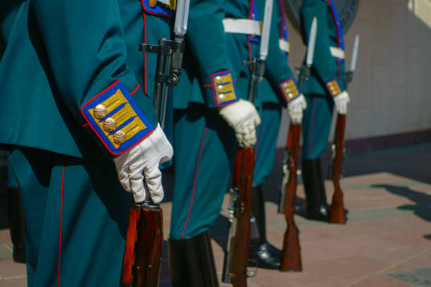 istock Soldiers in parade uniform with rifles 838865752