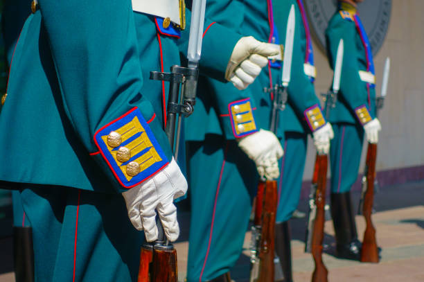 istock Soldiers in parade uniform with rifles 838866192