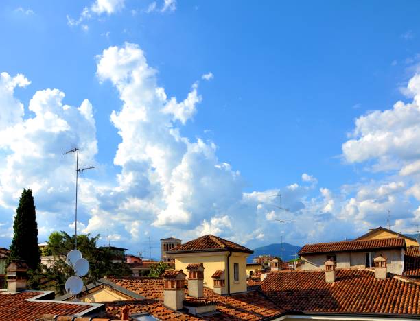 Old roofs with sky of summer clouds.