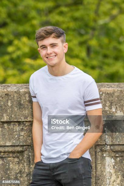 Teenage Boy In A Park On A Warm Summers Day Stock Photo - Download Image Now - Boys, 16-17 Years, 18-19 Years