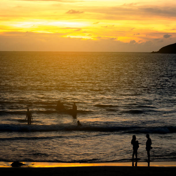 istock The silhouette at twilight on the beach, together is feel happy. 838886862