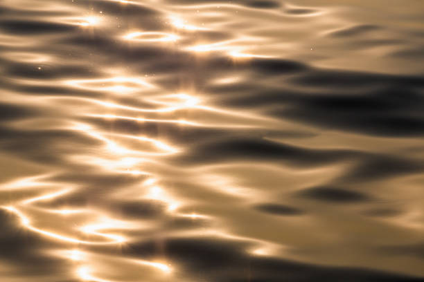 istock Water surface with wave of golden water 838886892