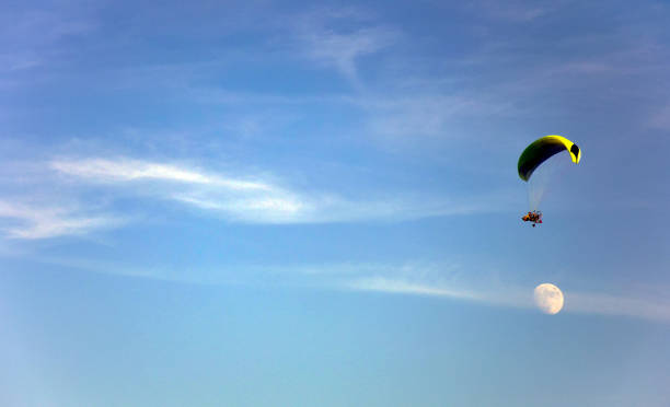 istock Paragliding in the sky with moon 838890980