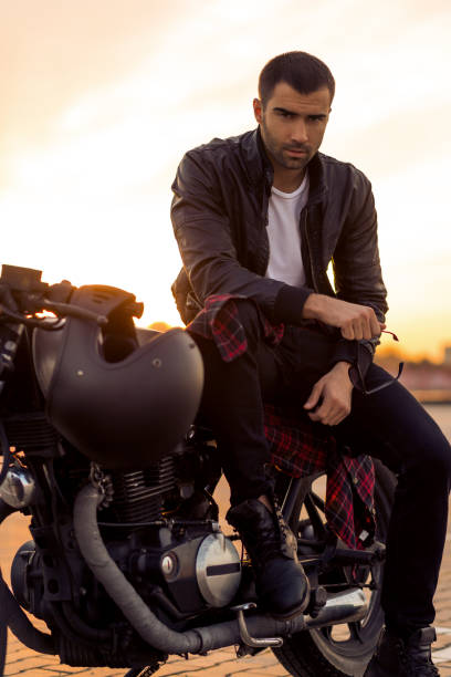 istock Brutal man sit on cafe racer custom motorbike. 838894126
