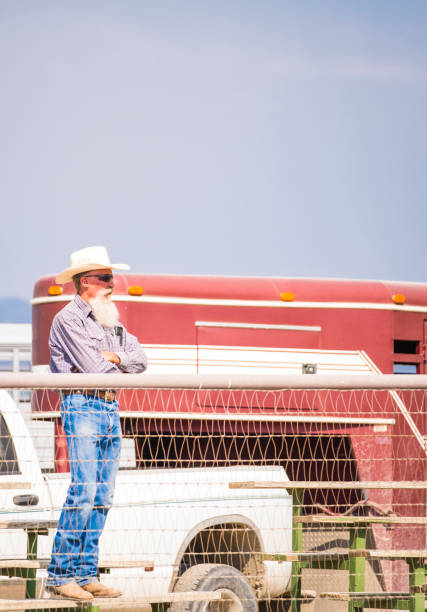 istock Mature Cowboy Stands On Bleachers Watching A Rodeo 838894562