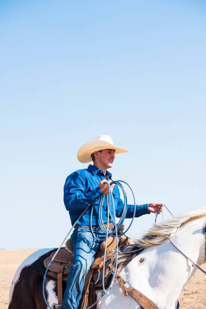 istock Happy Cowboy Riding Horseback 838894852