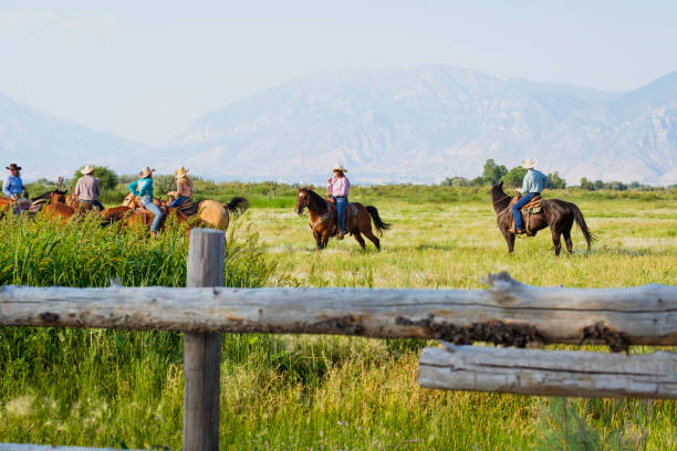istock Group Of Friends Horseback Riding On A Ranch 838894978