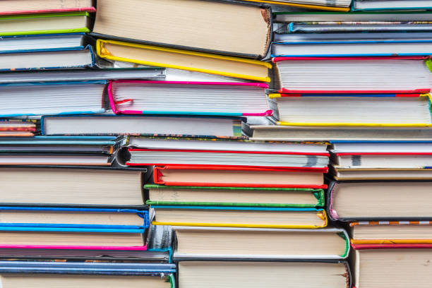 istock Stack of books on a shelf, multicolored book spines. 838895036
