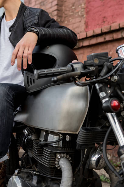 istock Brutal man sit on cafe racer custom motorbike. 838895044